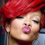 Rihanna with bright red hair color in 2011